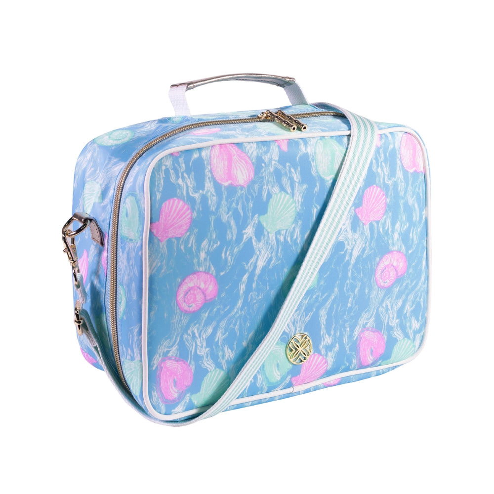 Angled side photo of a blue lunchbag with pink seashell pattern on a white background.