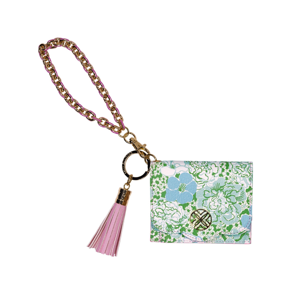Keychain with a green,white & blue floral design and pink tassel on a white background.