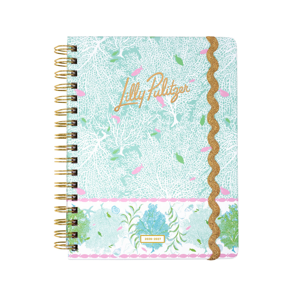 Lilly Pulitzer notebook with floral design and gold accents on a white background