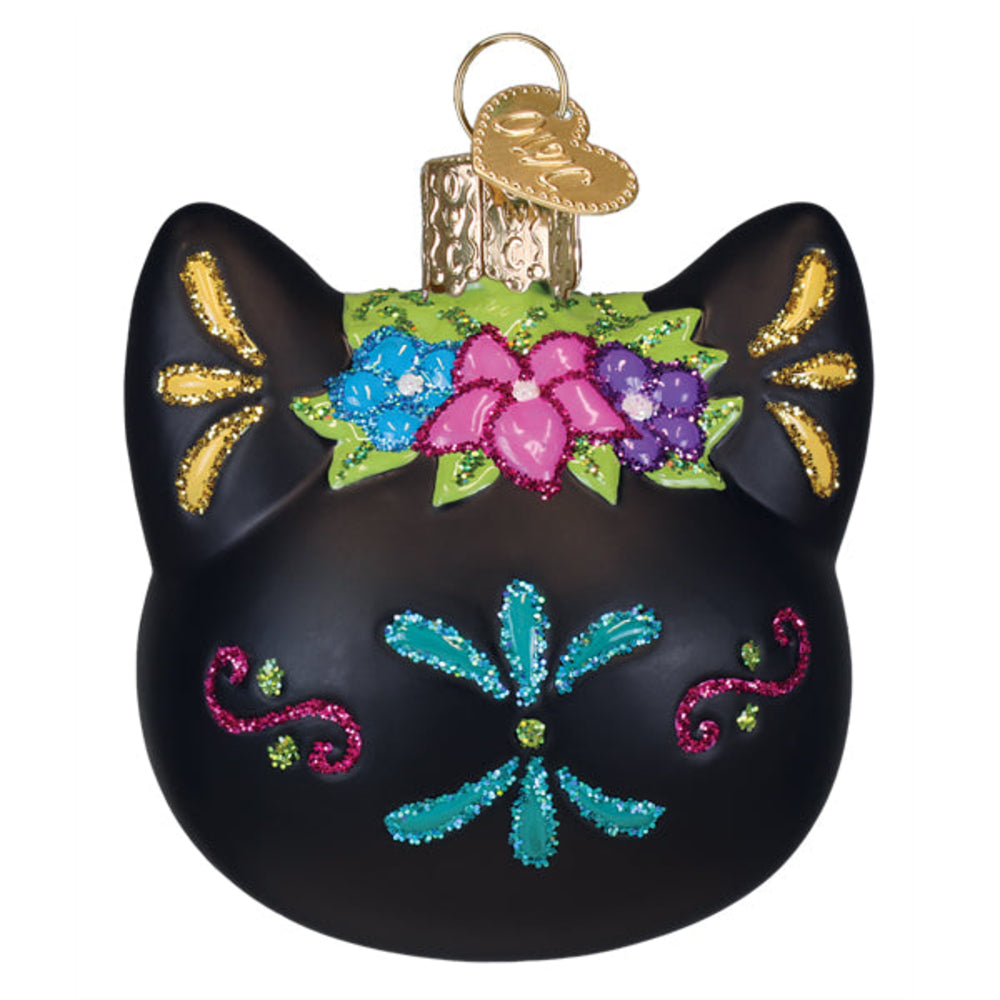 Decorative black cat ornament with colorful floral designs on a white background