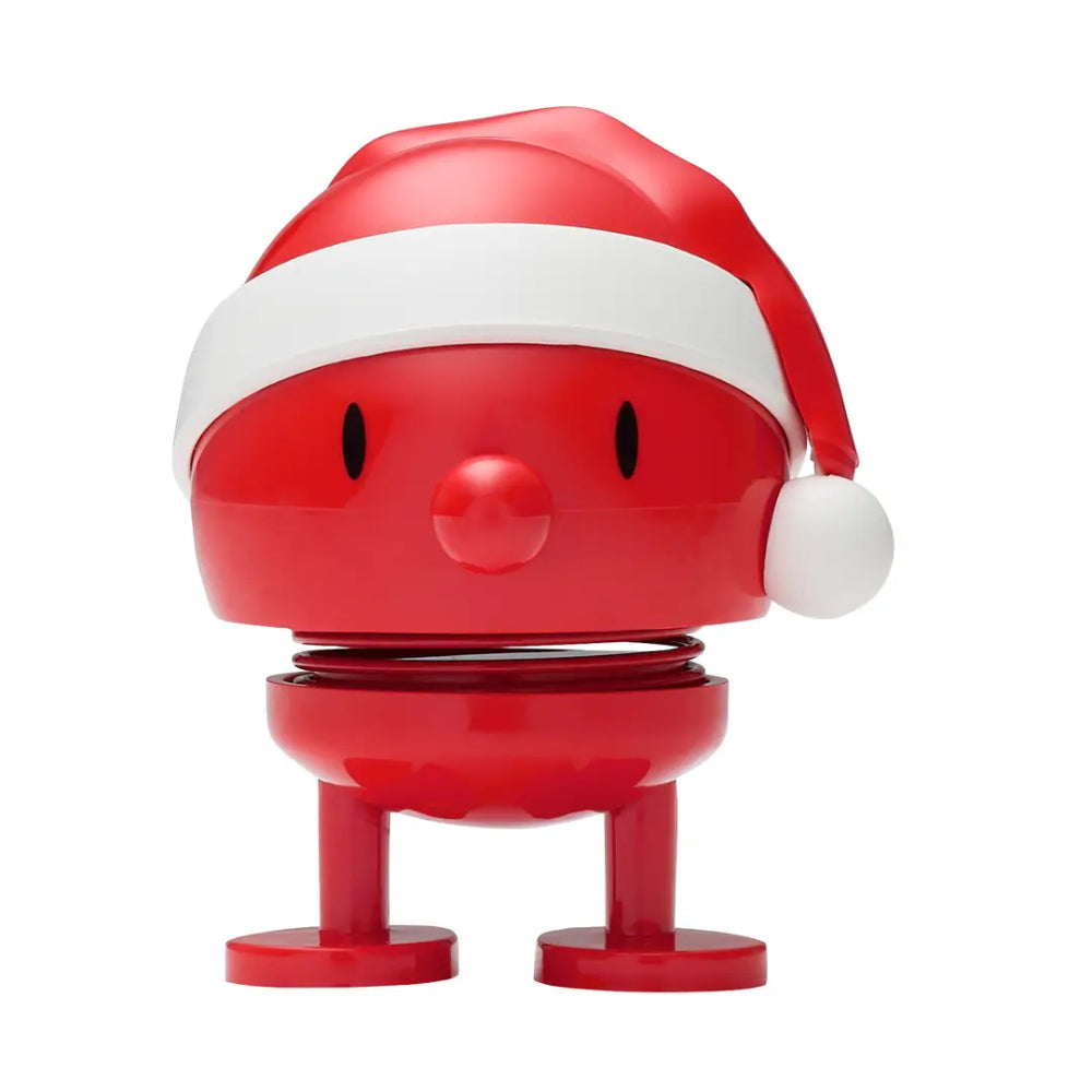 A red and white Santa hat-shaped spring toy with a round head, black eyes, a red nose, and small legs, shown on a plain white background.