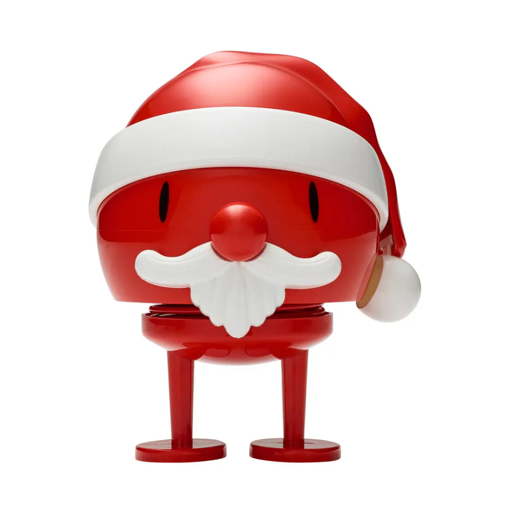 A red and white Santa Claus-themed figurine with a glossy finish, featuring a Santa hat, white beard, and small legs, set against a plain white background.