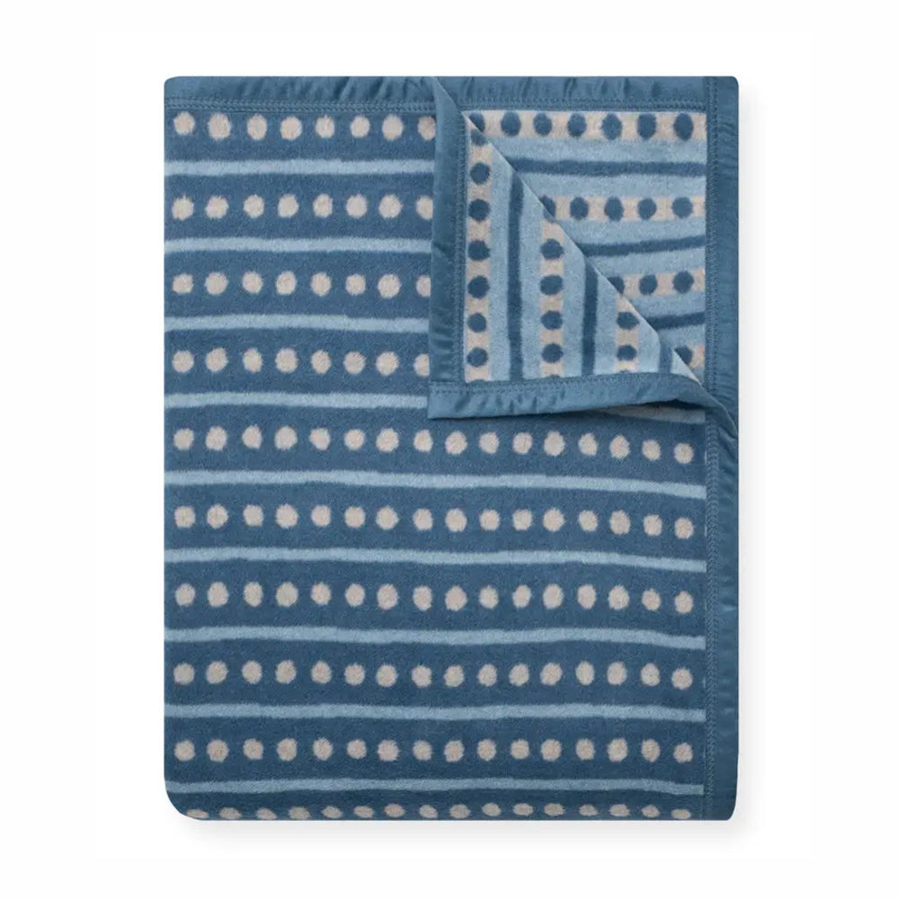Blue and white patterned blanket on a white background