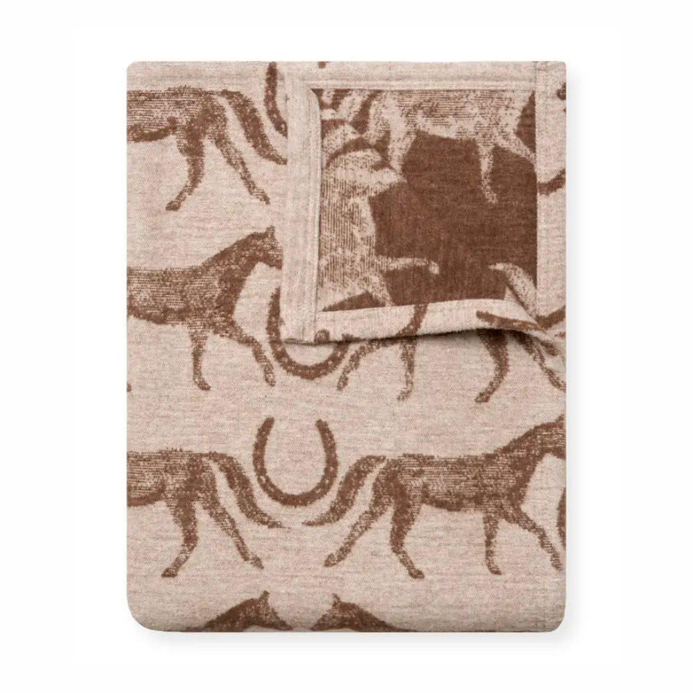 Blanket with horse pattern on a white background