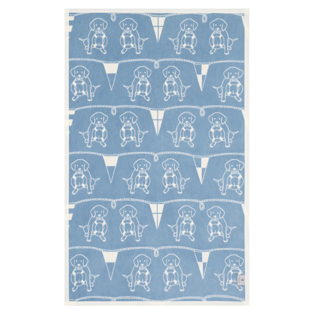 Blue blanket with white dog pattern on a white background