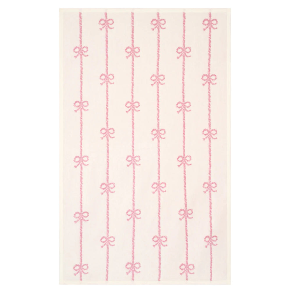 Pattern of pink bows on a white background