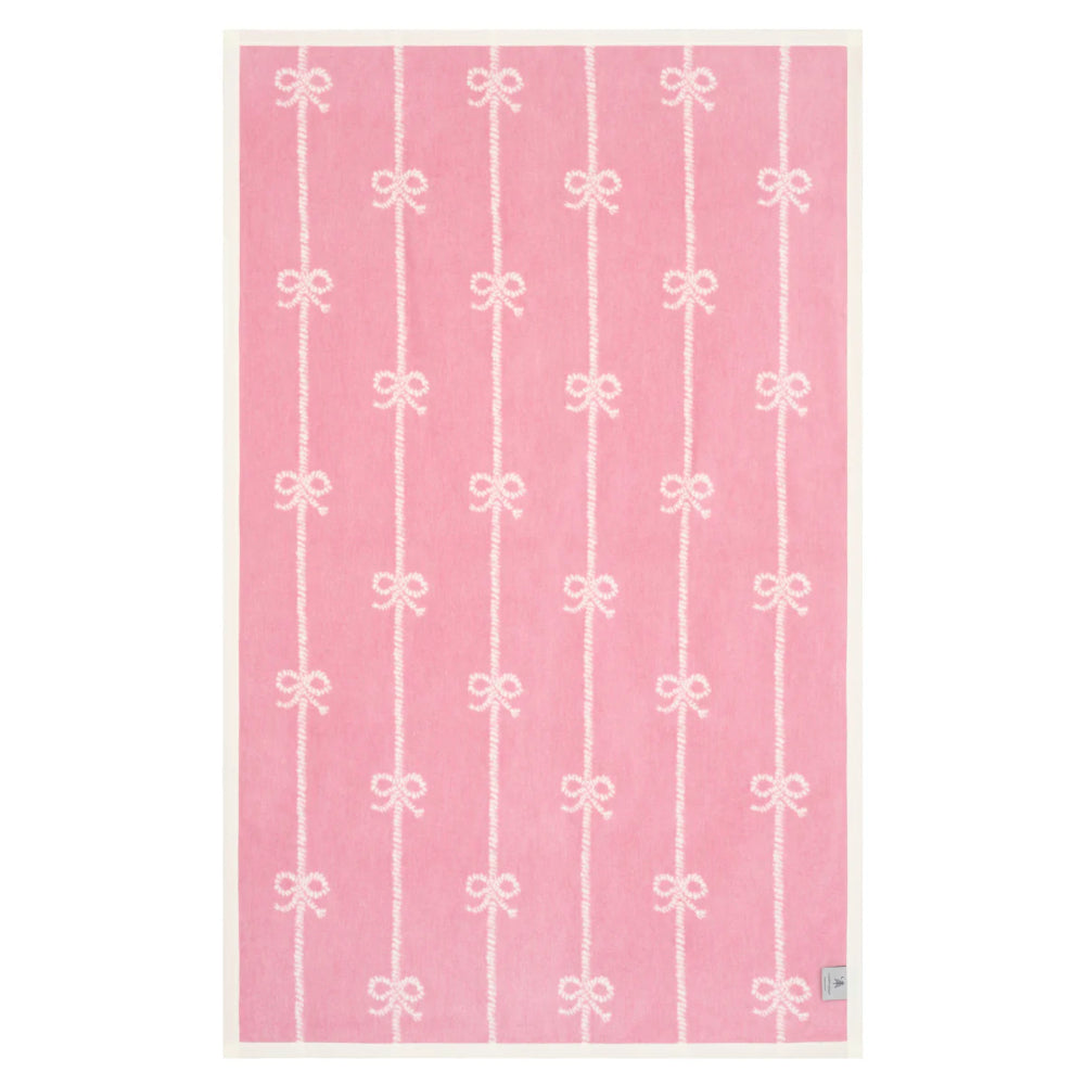 blanket with white bow pattern on a white background