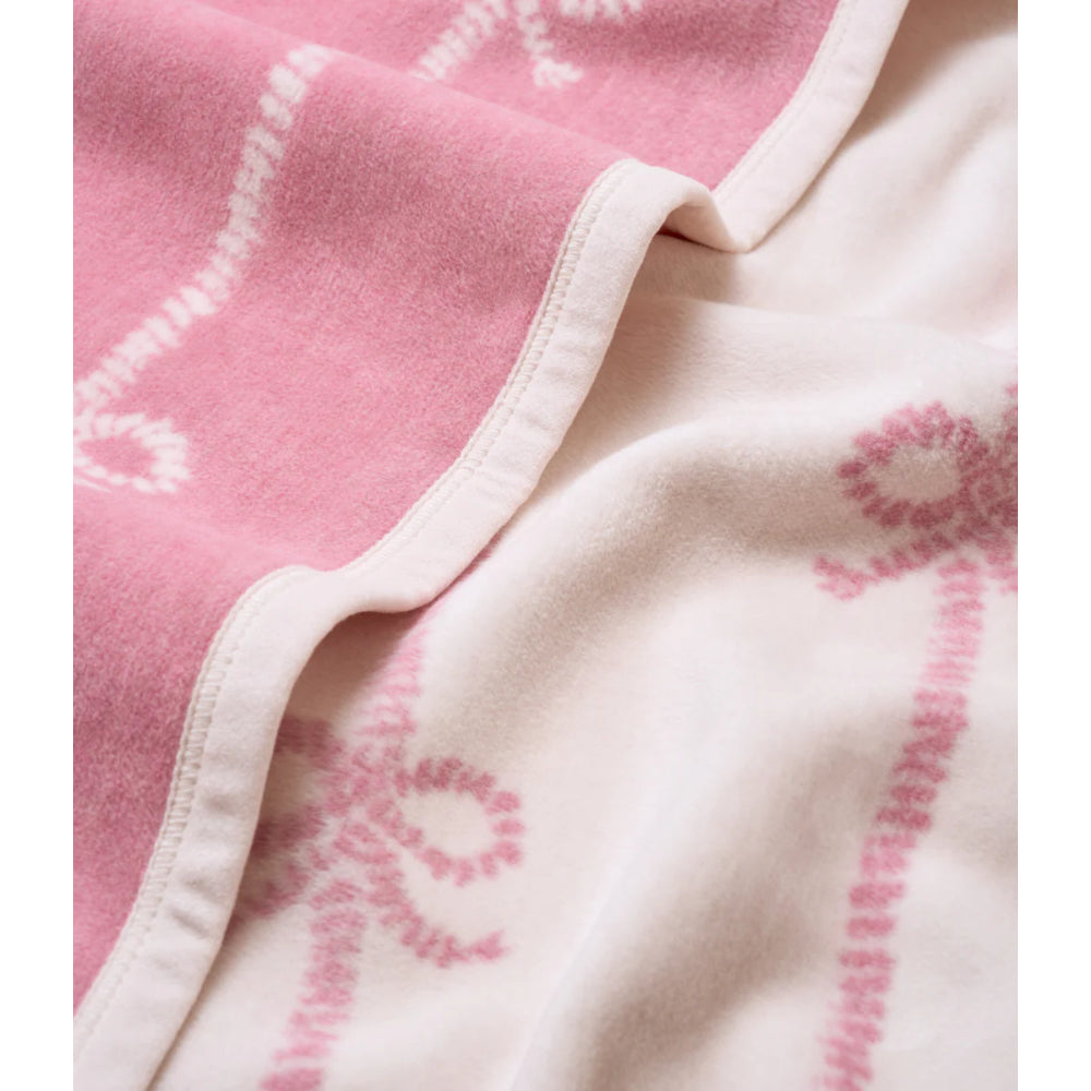 Close-up of a pink and white fabric with heart patterns