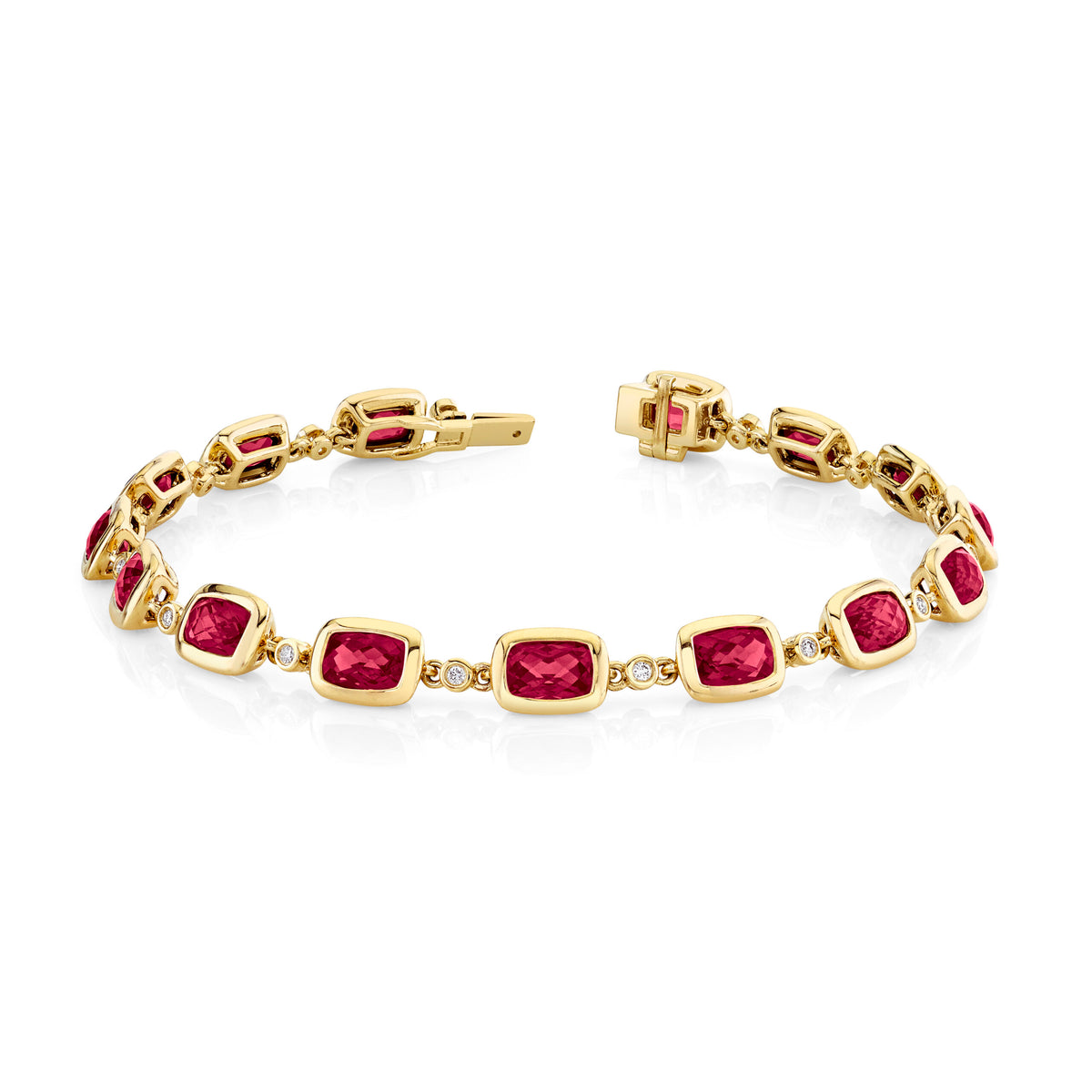 A yellow gold tennis bracelet featuring rectangular cushion-cut pinkish-red gemstones and small clear accent stones, displayed on a clean white background.