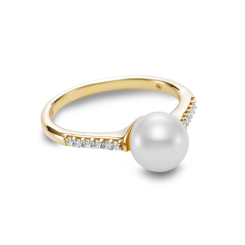 A yellow gold ring featuring a large, lustrous white pearl and a row of small clear stones along the band, set against a clean white background.