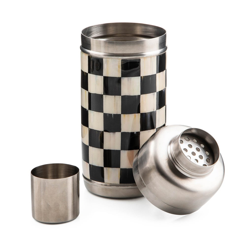 Metallic shaker with checkered pattern and detachable parts on a white background