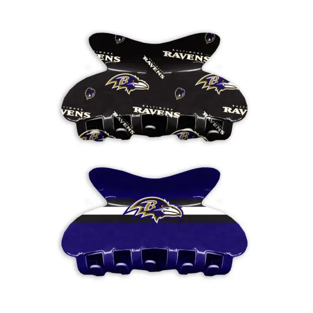 Two hair clips with Baltimore Ravens logo on a white background