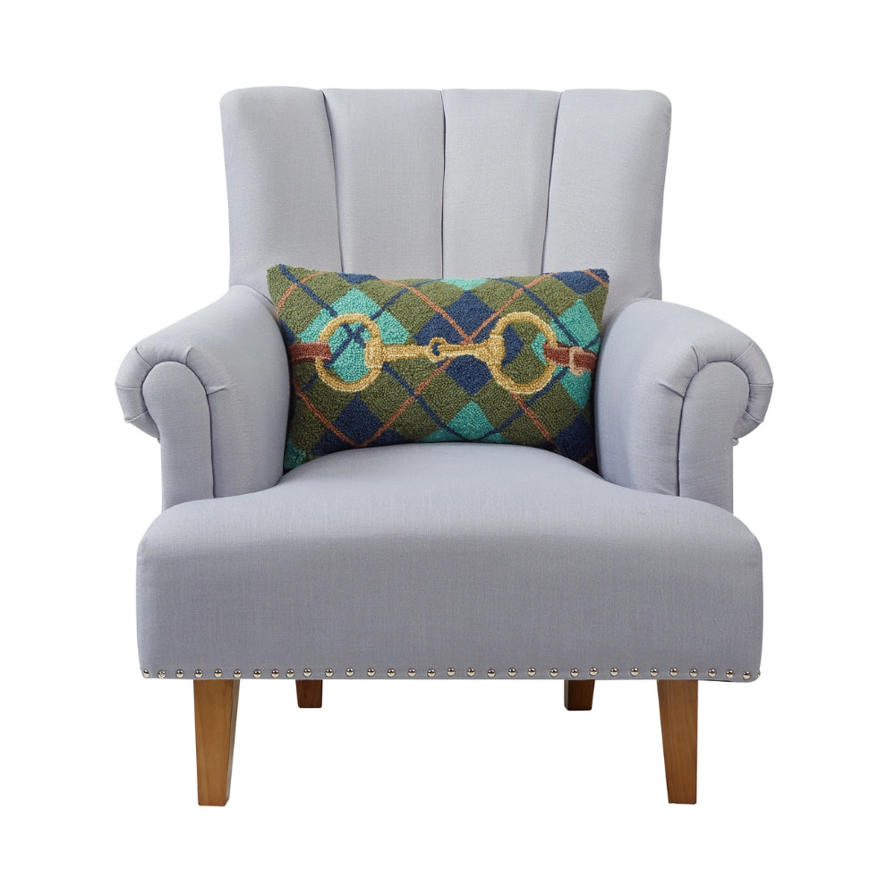 A Gingham Bucke Hook Pillow displayed on a Gray chair on a white background.
