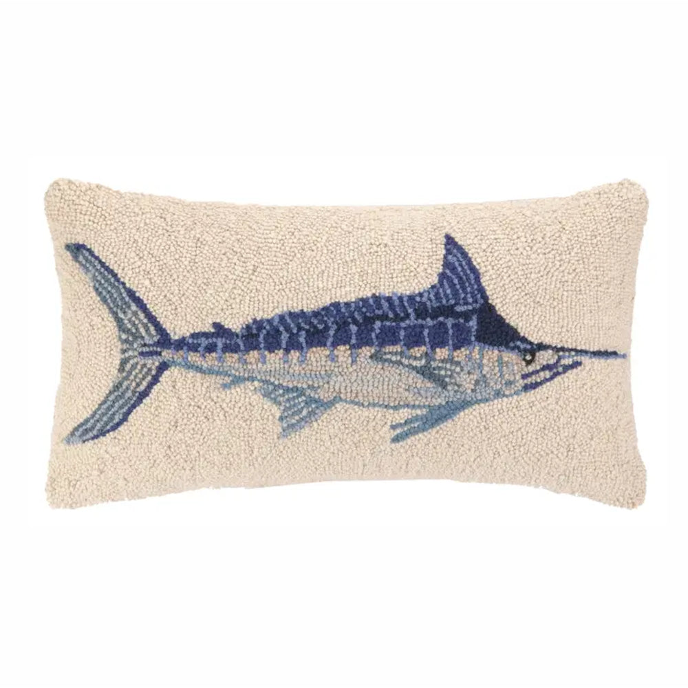 Beige pillow with a blue fish design on a white background