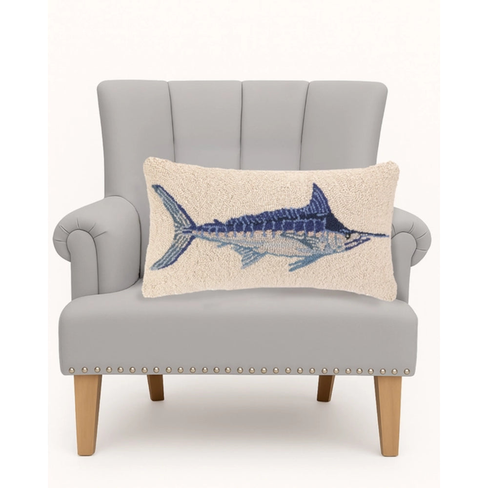 Gray armchair with a decorative pillow featuring a blue fish design on a white background