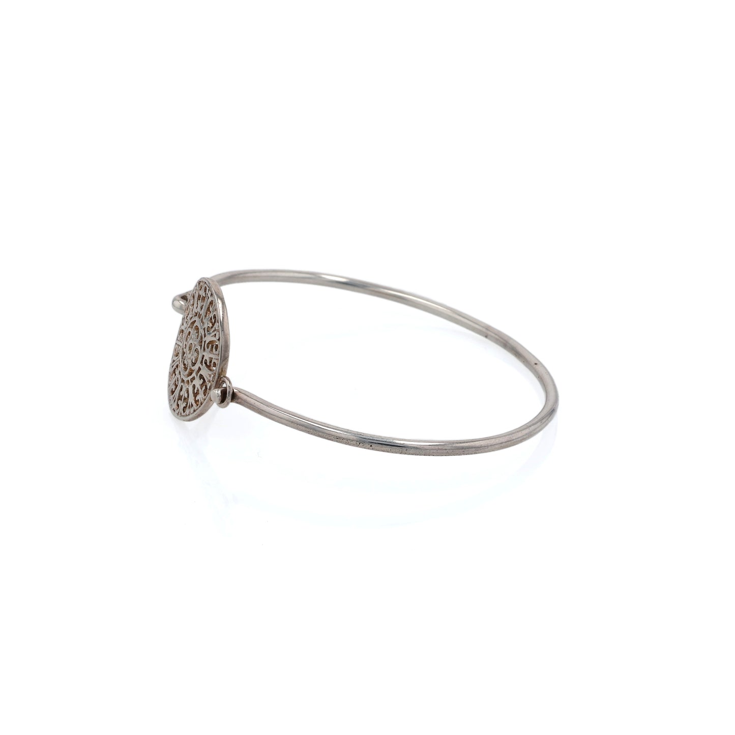 Side View of Silver bracelet with a decorative circular medallion on a white background