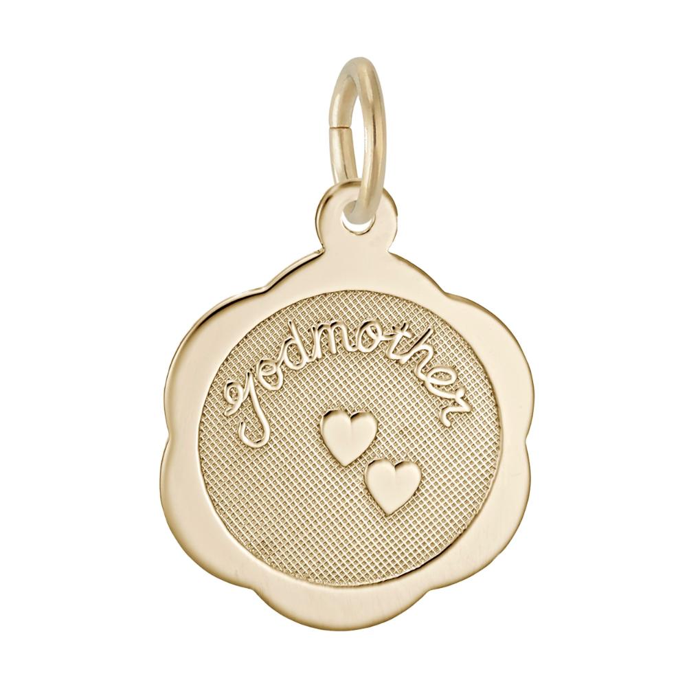 Gold charm with 'godmother' and heart designs on a white background