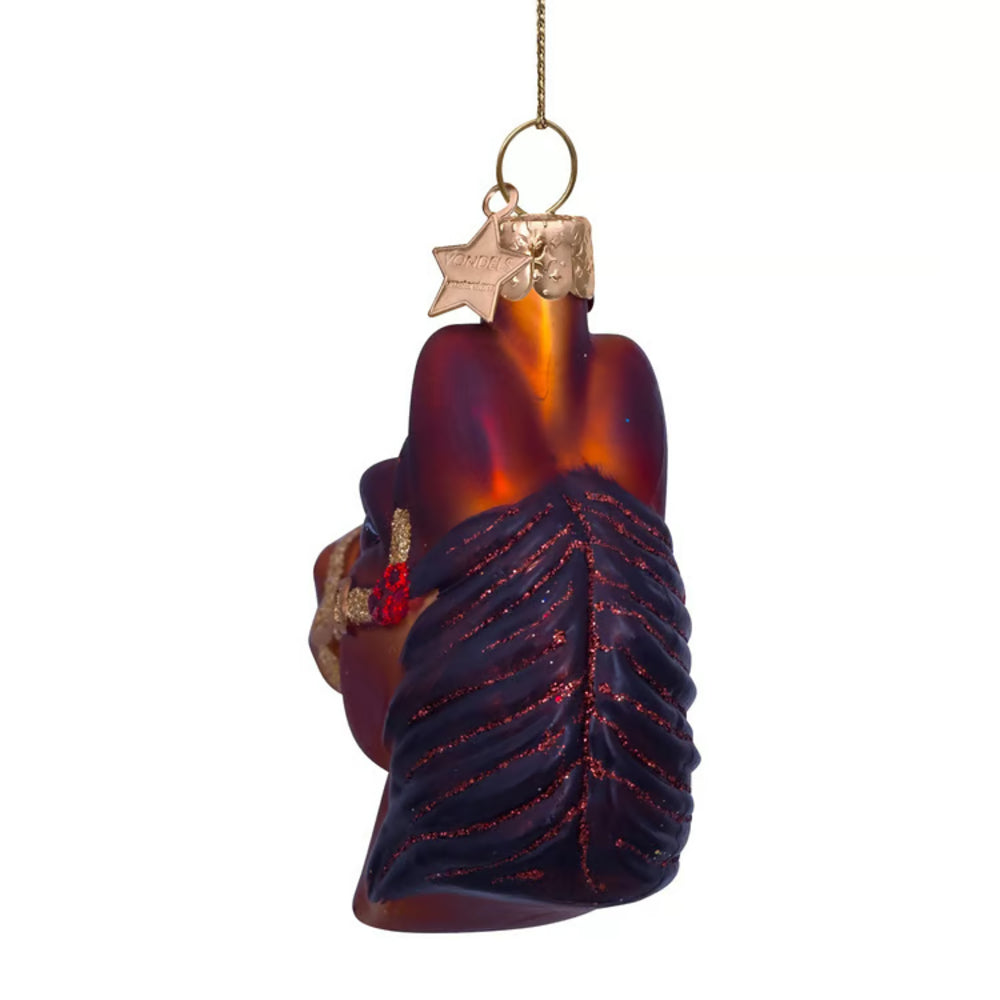 Decorative glass ornament shaped like a hand with a star, on a white background