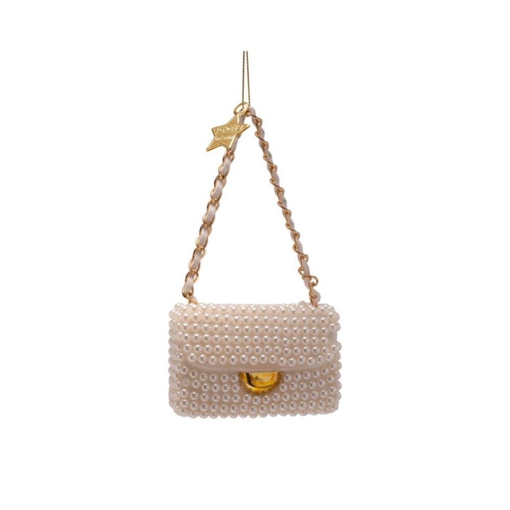 Pearl-handled handbag ornament with gold accents on a white background