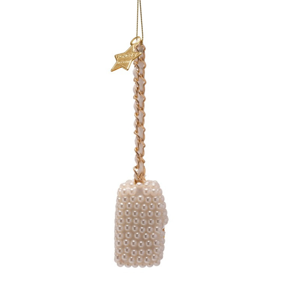 Decorative pearl ornament with a gold chain on a white background