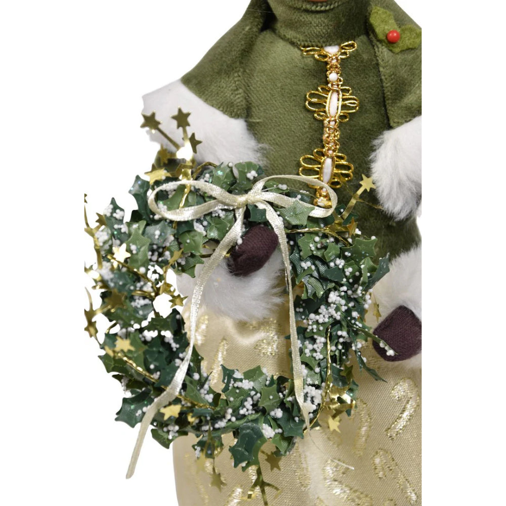 A close photo of a wreath Mrs. Claus  is holding on a white background