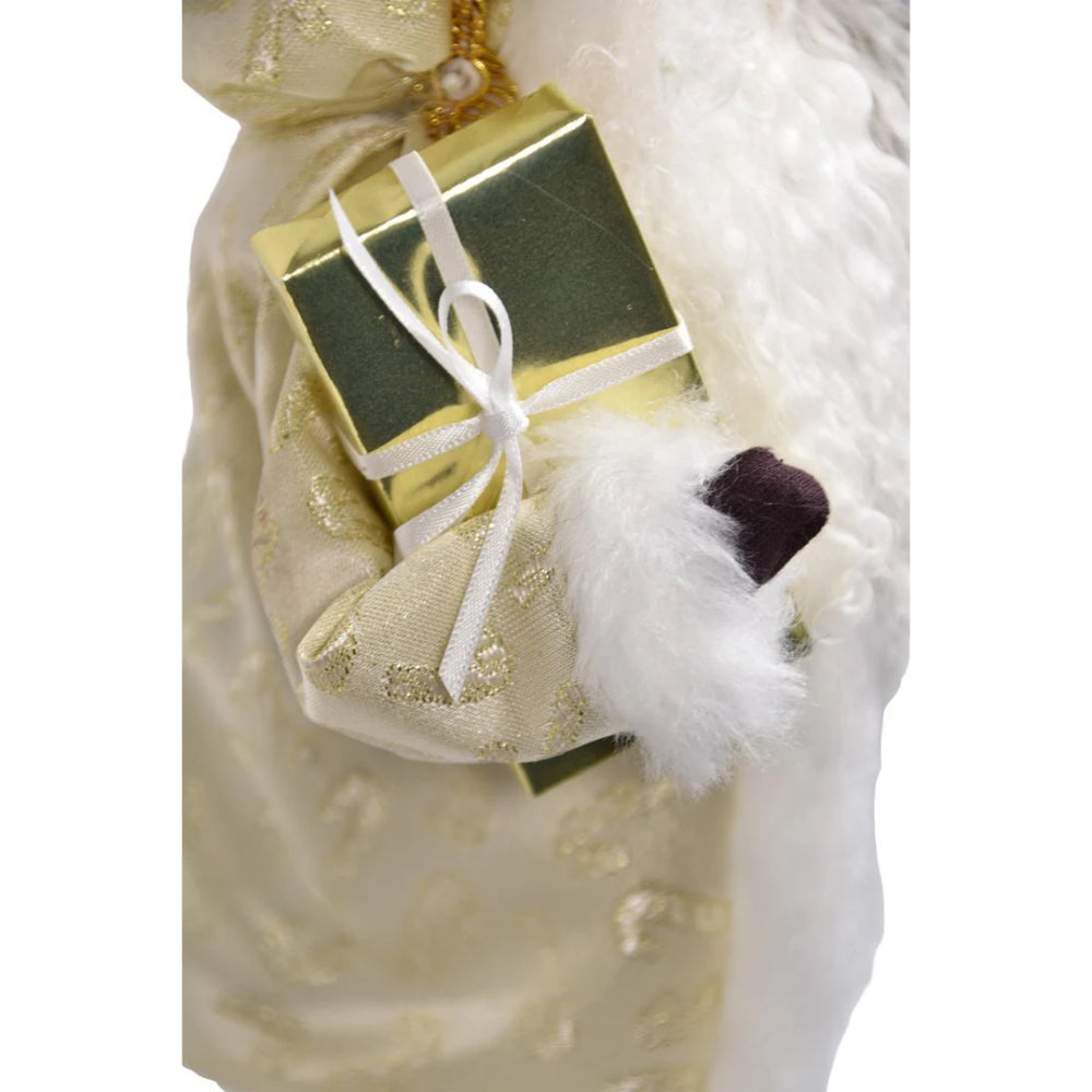 A  close up photo of a gift being held by  Santa in a, green and gold outfit,  on a white background