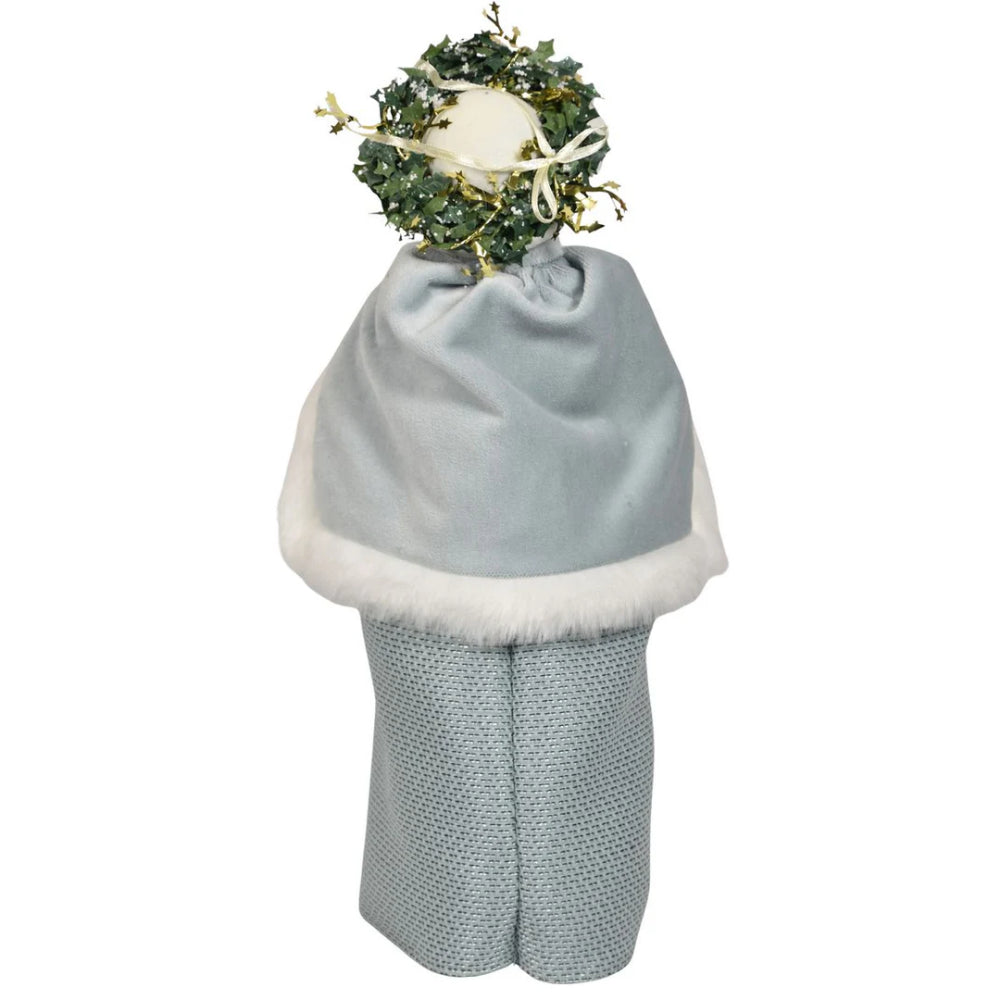 Back of a decorative figurine of a nautical mrs.claus  in traditional attire with a basket on a white background