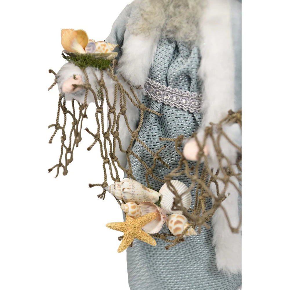 A close up photo of a net with sea shells and starfish being held by the Nautical Santa on a white background.