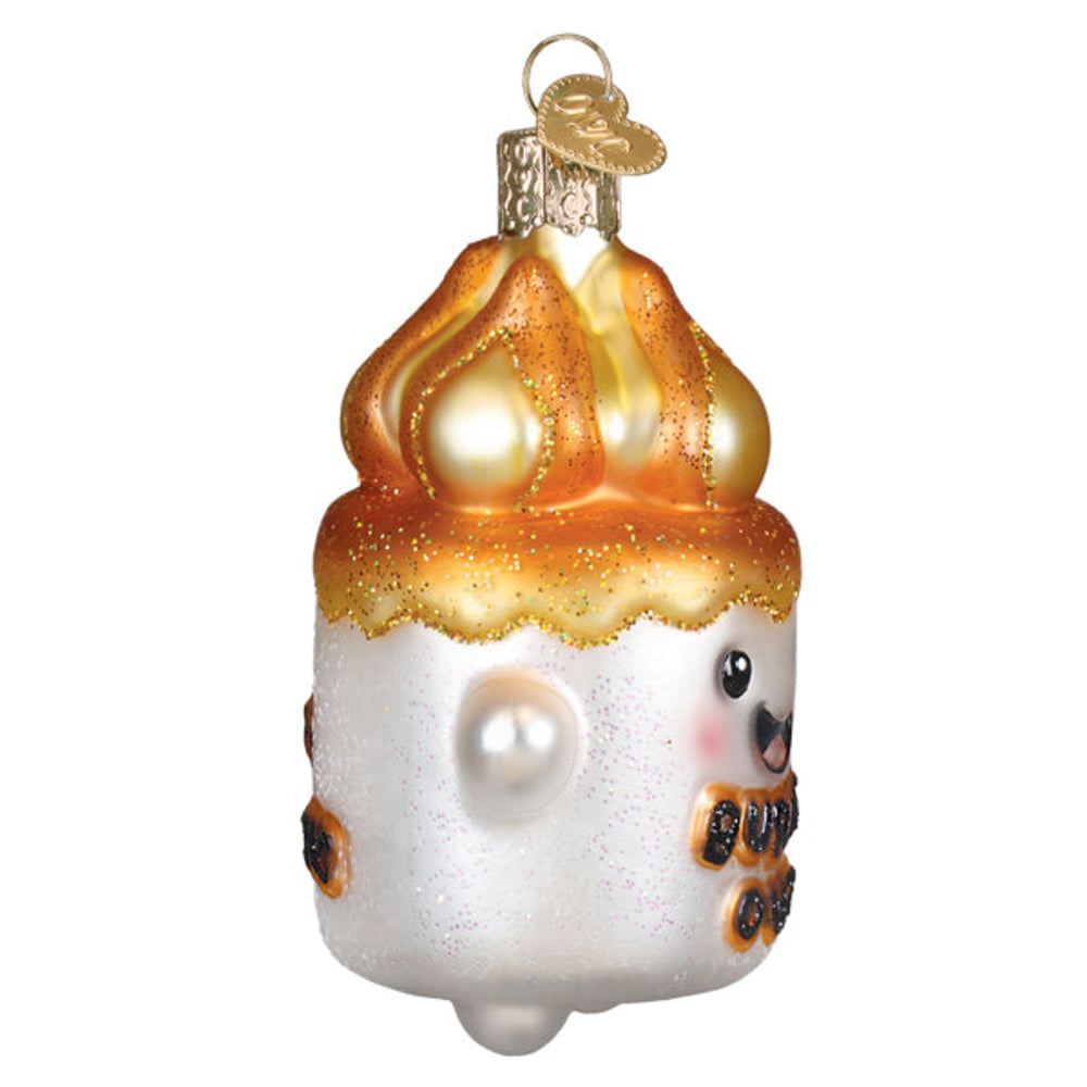 Glass ornament shaped like a marshmallow with a burnt edge on a white background