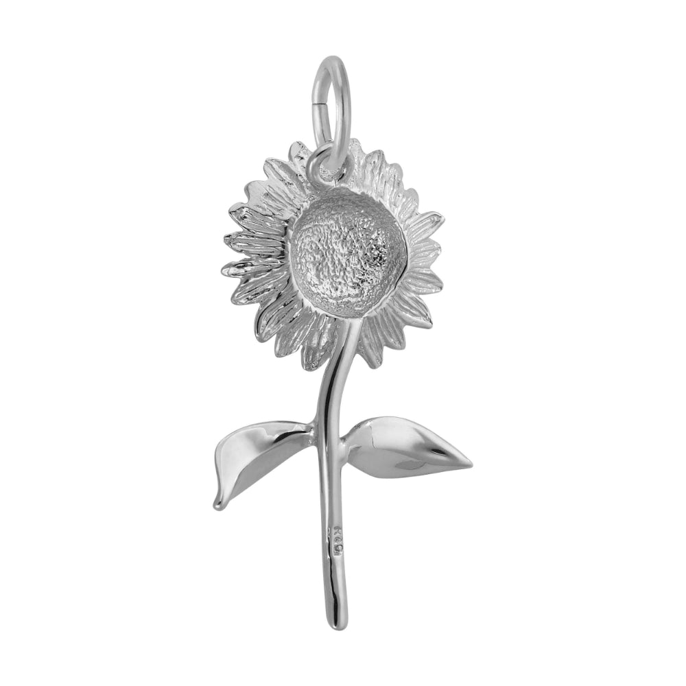 Back of A silver sunflower charm pendant with detailed petals, a textured center, and two leaves on a stem, shown against a plain white background.