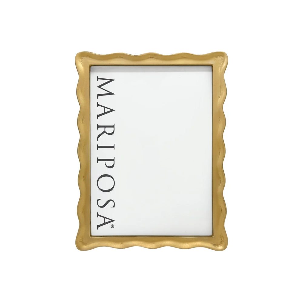A rectangular picture frame with a wavy scalloped edge in a metallic gold finish, featuring a white insert with the brand name 'MARIPOSA' printed vertically in black.
