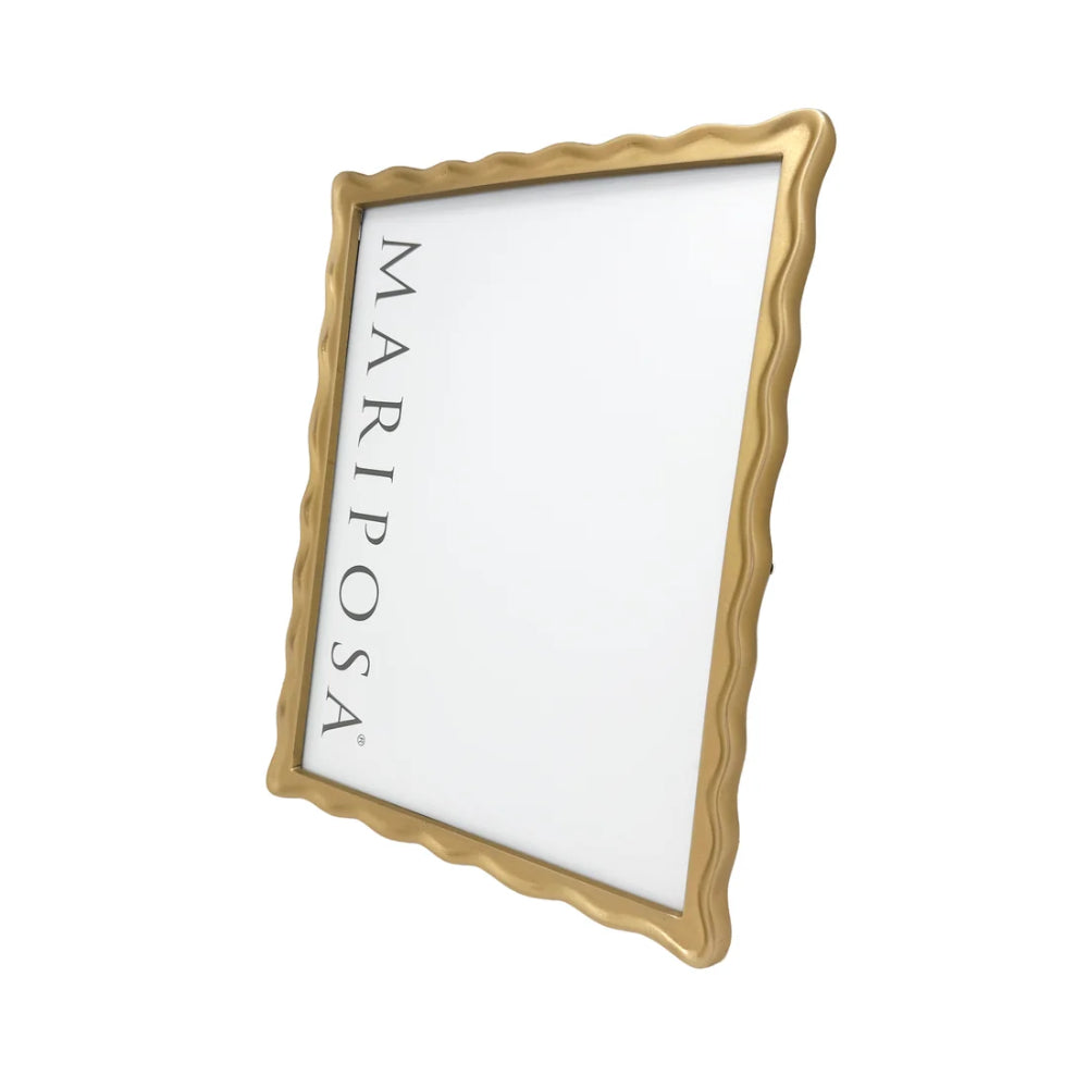 A rectangular picture frame with a wavy scalloped gold border and a white center, shown at an angle on a plain white background. The brand name 'MARIPOSA' is printed vertically in black along the left side of the white panel.