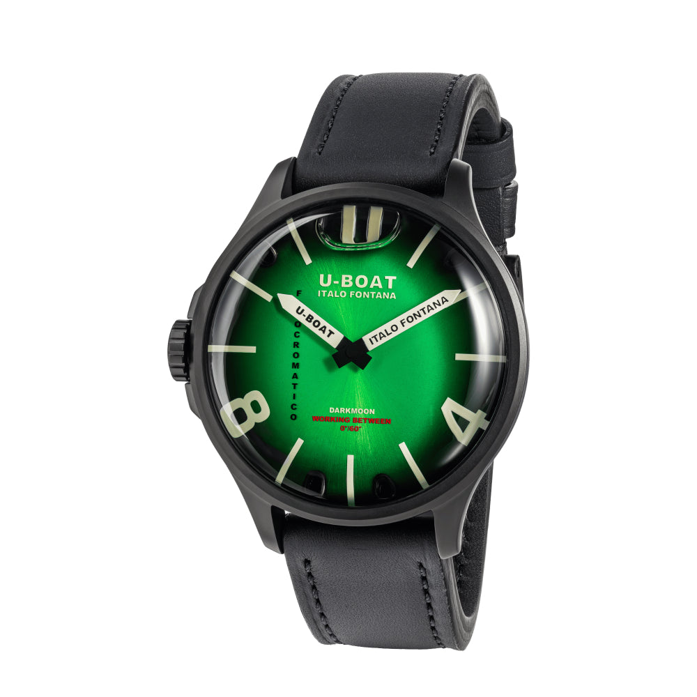 A wristwatch with a black leather strap and a black case, featuring a vibrant green dial with white and green hands and white Arabic numerals, shown on a plain white background.