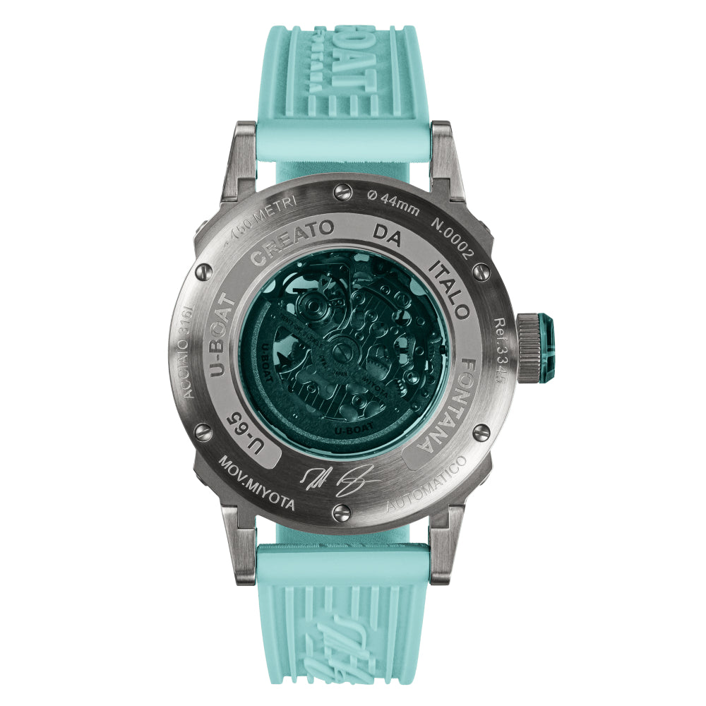 Watch with turquoise strap and black dial on a white background