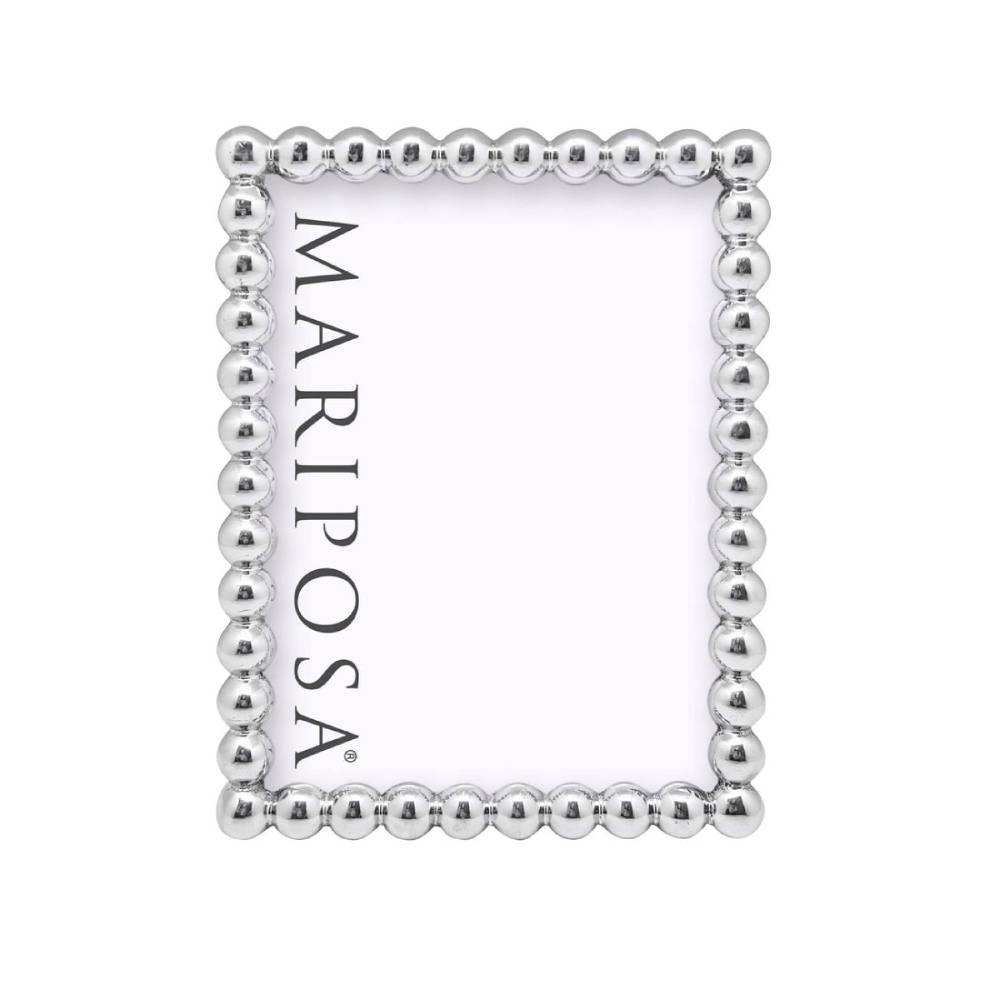 A silver metallic picture frame with a decorative beaded border, shown on a plain white background. The brand name 'MARIPOSA' is printed vertically inside the frame.