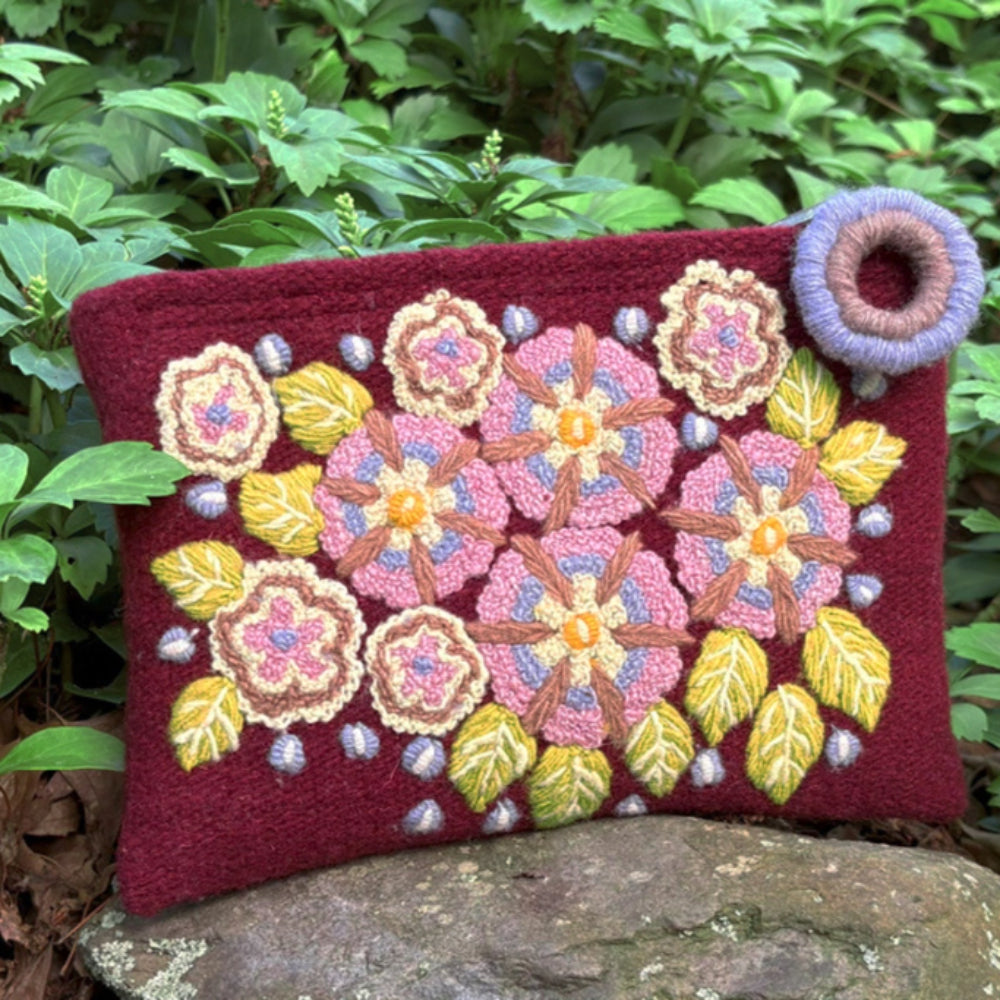 Decorative pouch with floral patterns on a natural background