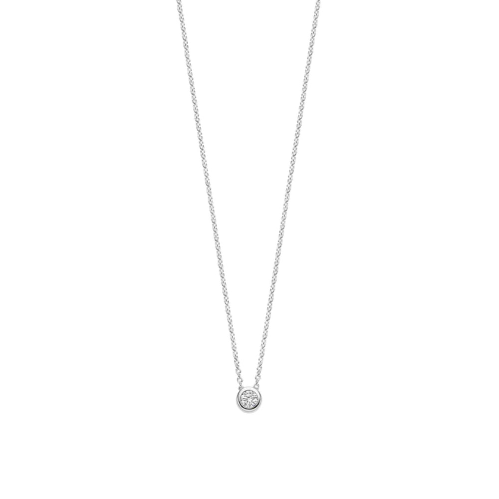 Silver necklace with a small round pendant on a white background