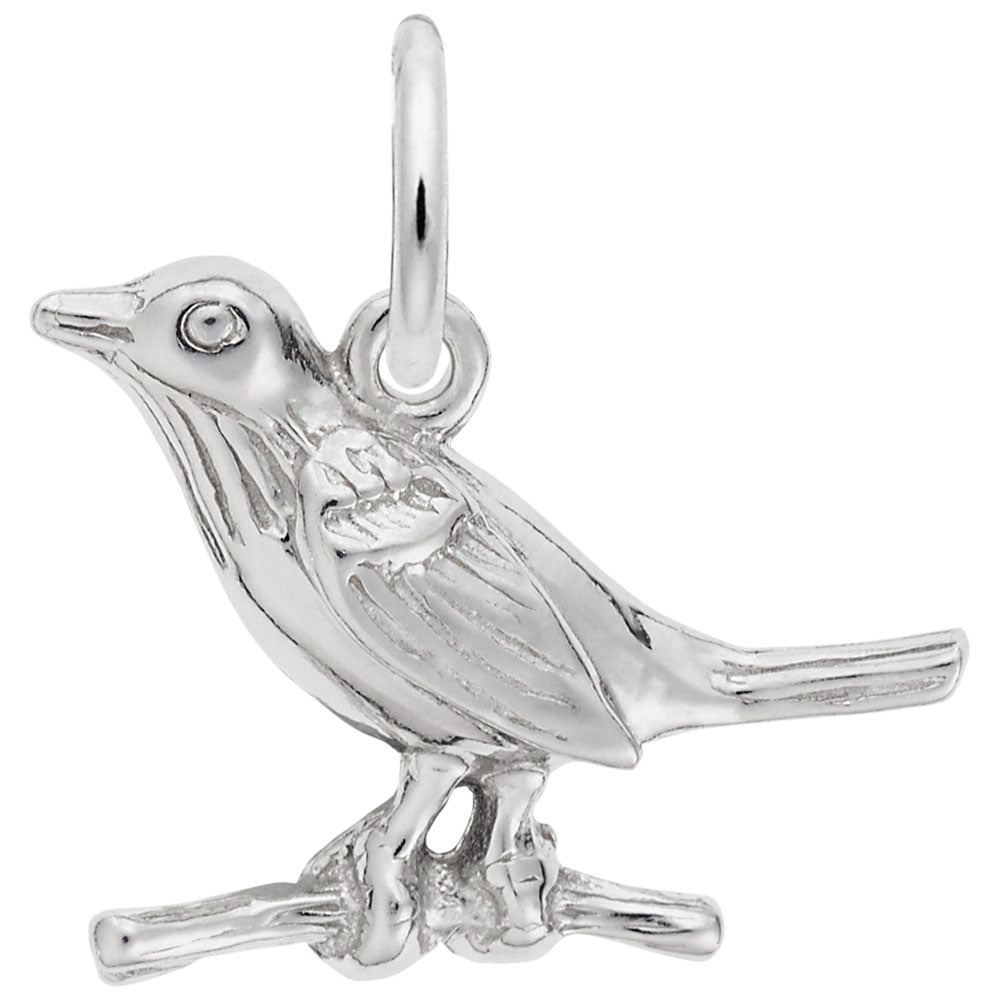 Silver bird on a branch charm on a white background
