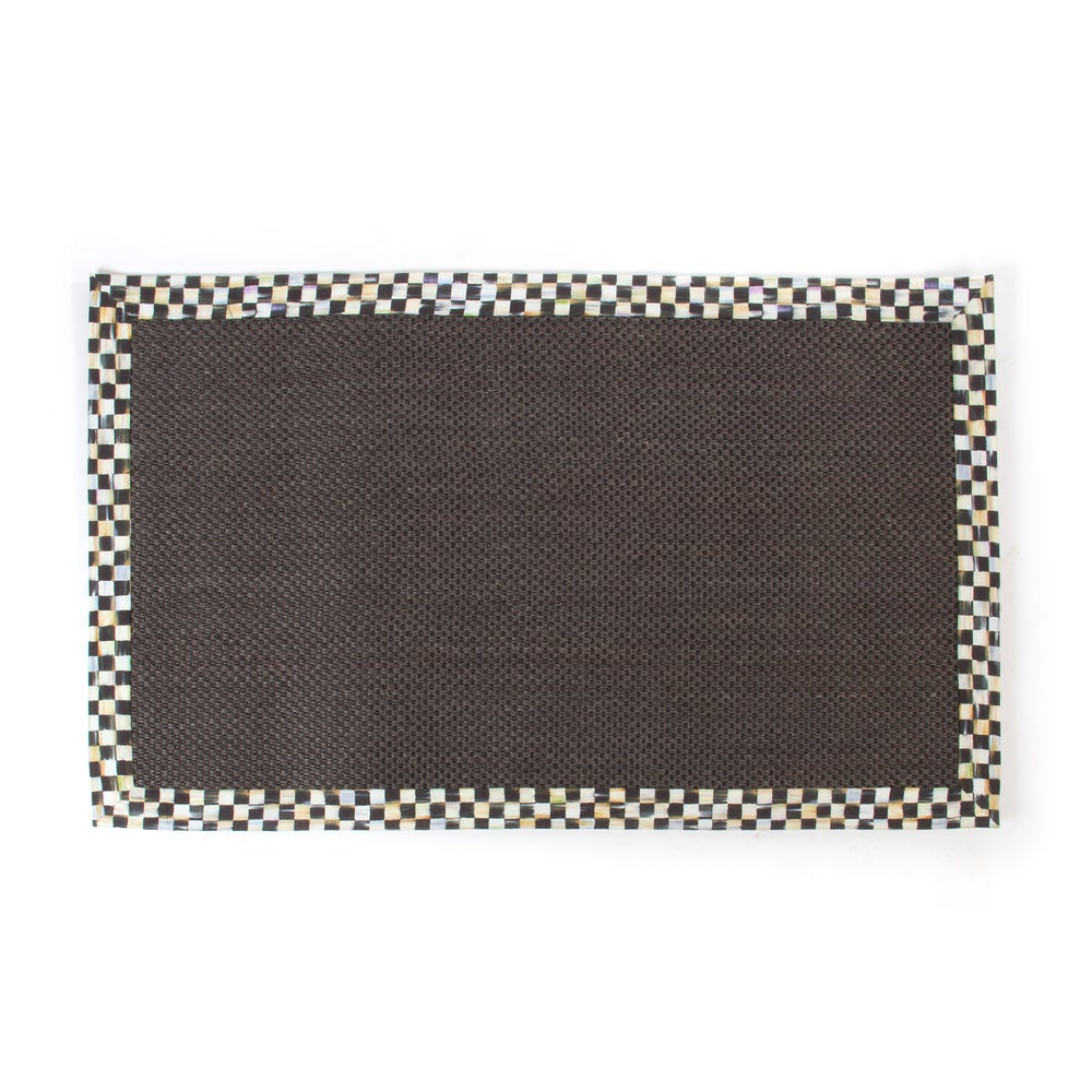 MacKenzie-Childs courtly check black sisal rug with black checkered border on a white background