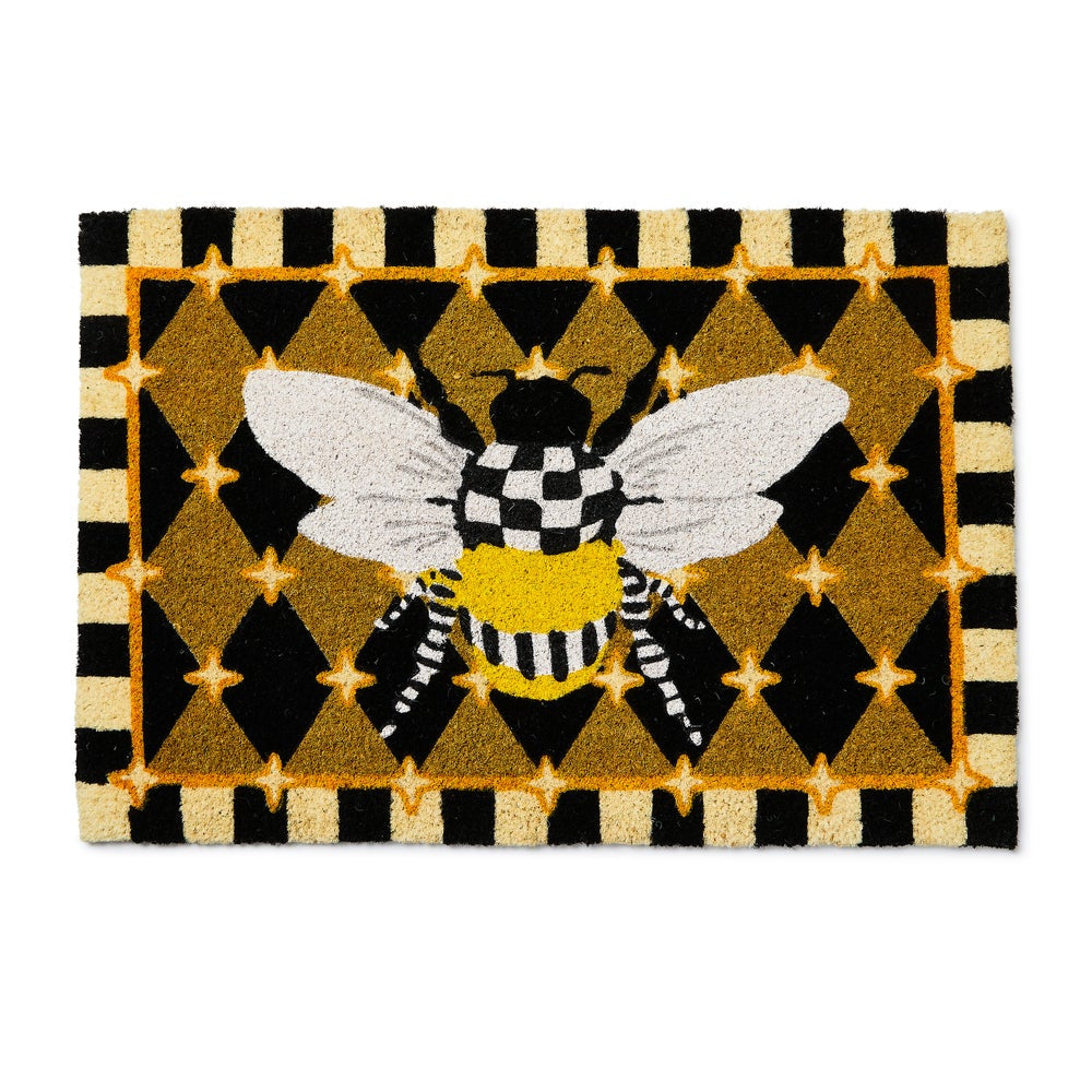 Doormat with a bee design on a  Honeycomb patterned background.
