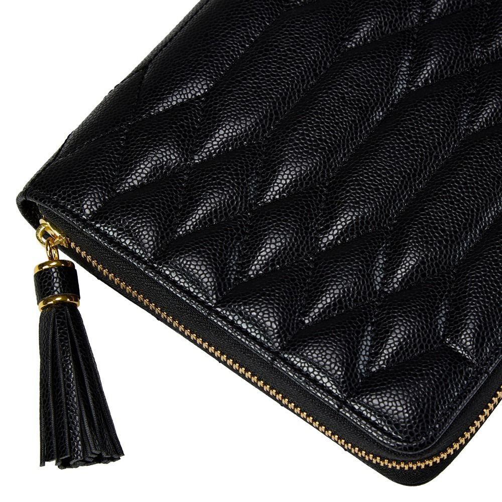 Black quilted leather zip-around clutch with a gold-tone zipper and a black tassel zipper pull on a white background.