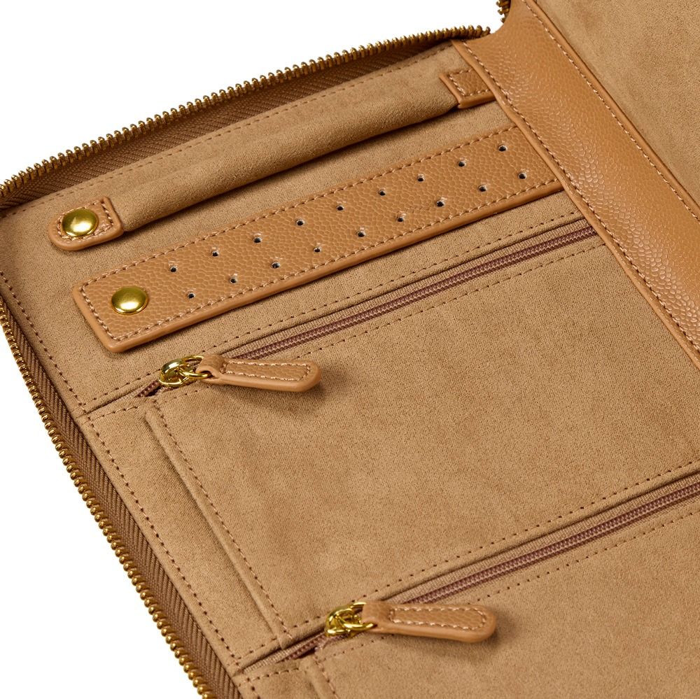Close-up of a tan leather organizer or clutch with multiple zip compartments, a perforated leather accent strip, and gold-tone hardware on a white background.