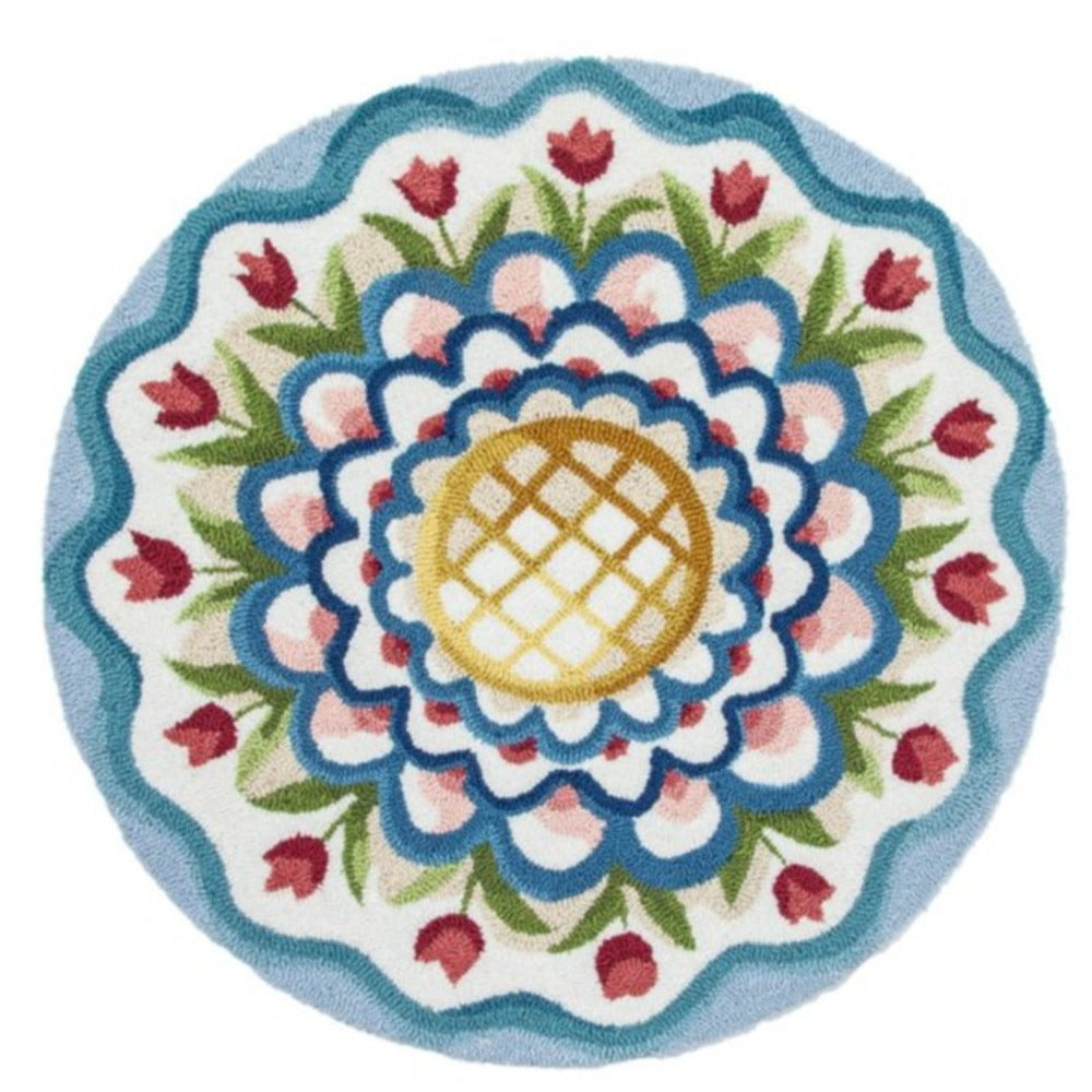 Round embroidered rug with floral design and central pineapple motif on a white background