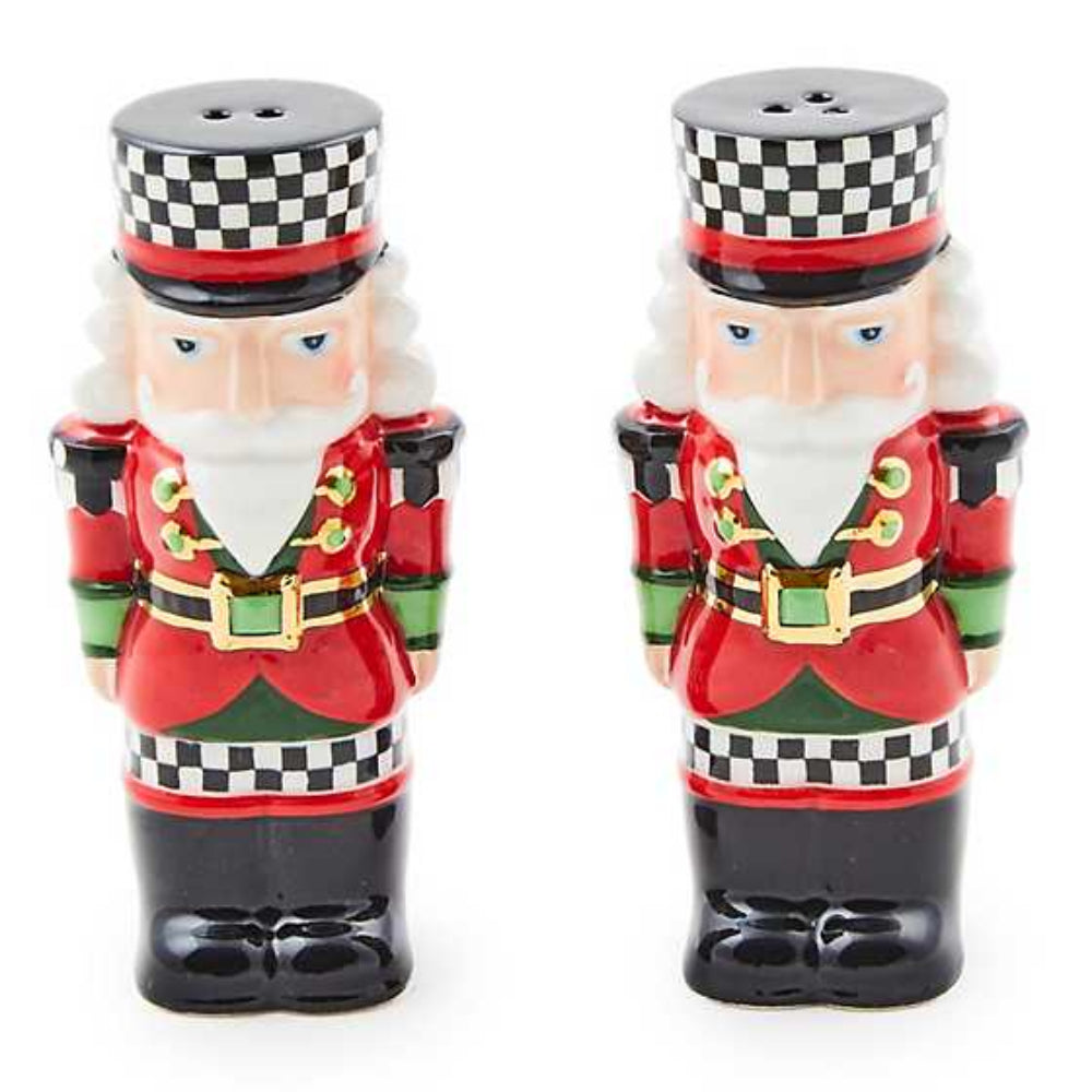 Two nutcracker-themed salt and pepper shakers on a white background