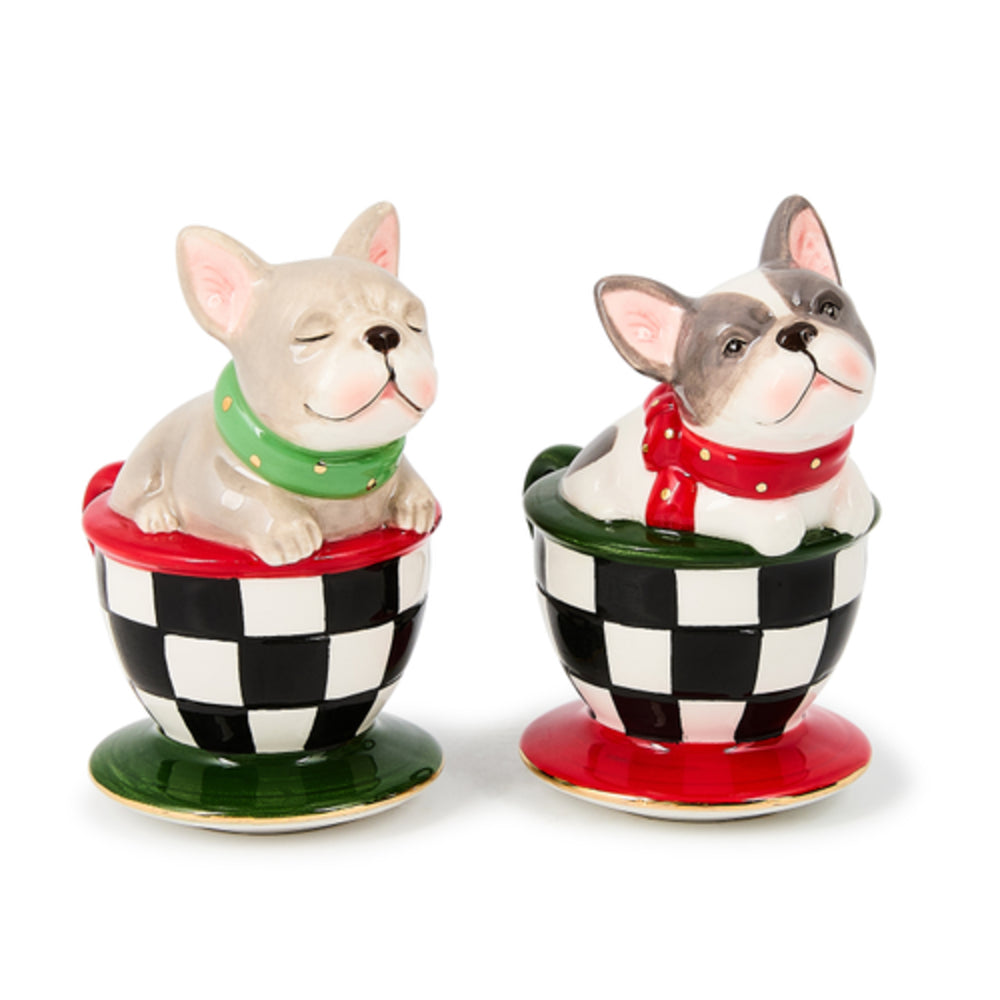 Two ceramic dog figurines on checkered bases with red collars.