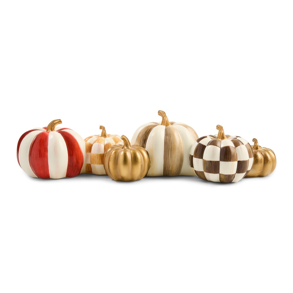 A set of decorative faux pumpkins in various sizes and patterns, including red and white stripes, gold and white stripes, solid gold, beige and white stripes, and a brown and white checkerboard pattern, arranged on a white background.