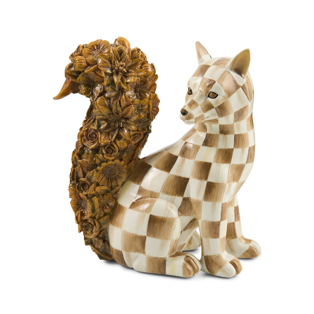A decorative figurine of a fox with a checkered tan and cream body and a large, highly detailed brown floral tail, set against a plain white background.