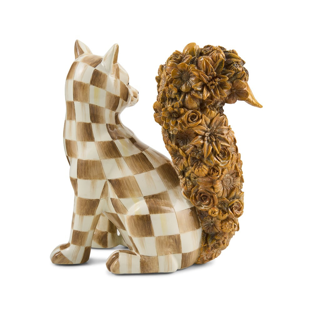 The back of a decorative figurine of a fox with a checkered tan and cream body and a large, highly detailed brown floral tail, set against a plain white background.