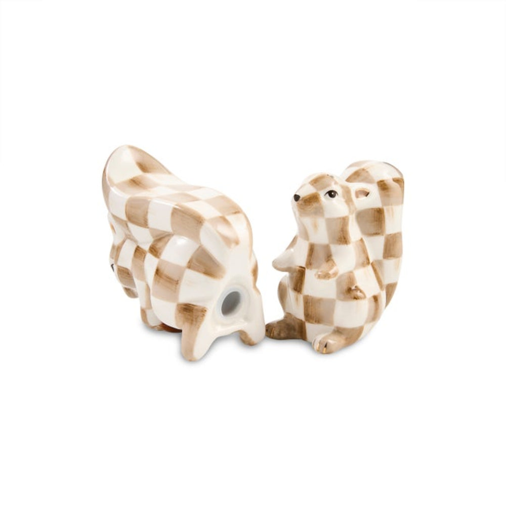 Two ceramic animal figurines, a cow and a rabbit, decorated with a brown and cream checkered pattern, set against a plain white background.