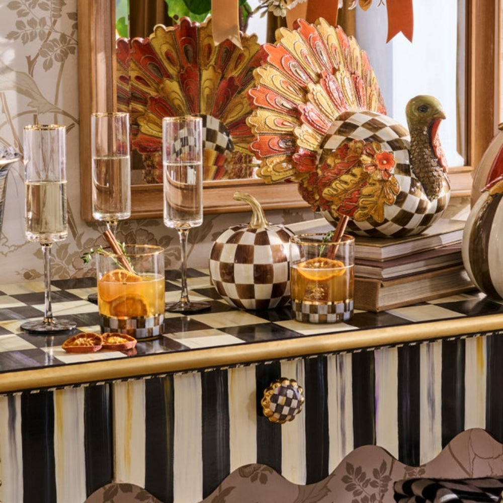 A collection of MacKenzie decor items featuring their chocolate check patterns.